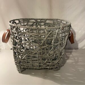 Woven gray Basket with brown Leather Handles width 14” deep 11” 4 metal feet